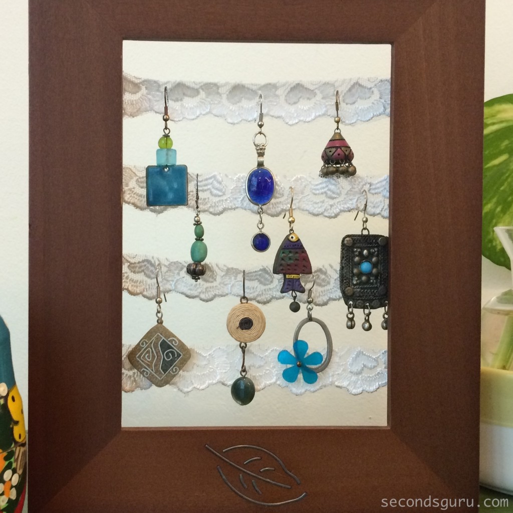 Tips & Tricks | Transform old junk jewellery into stylish home decor pieces |Capture the vintage feel of your old earrings by displaying them on lace in a picture frame.