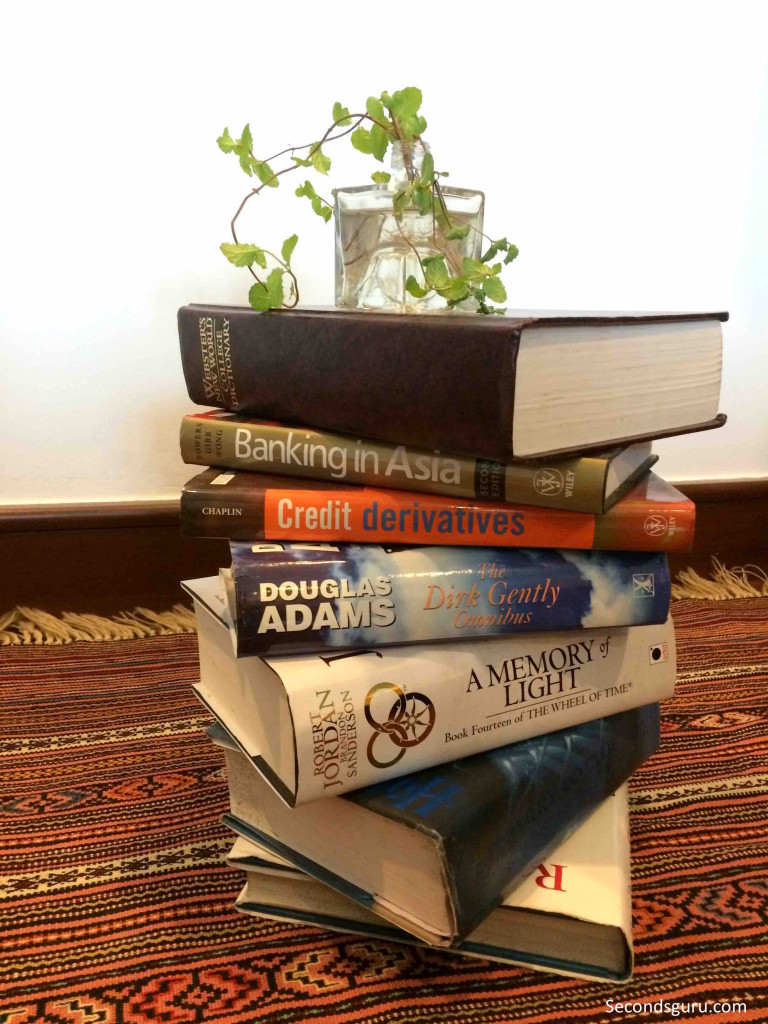 Ye olde dictionary! 4 book hacks to repurpose old books. Stack them to make a table!