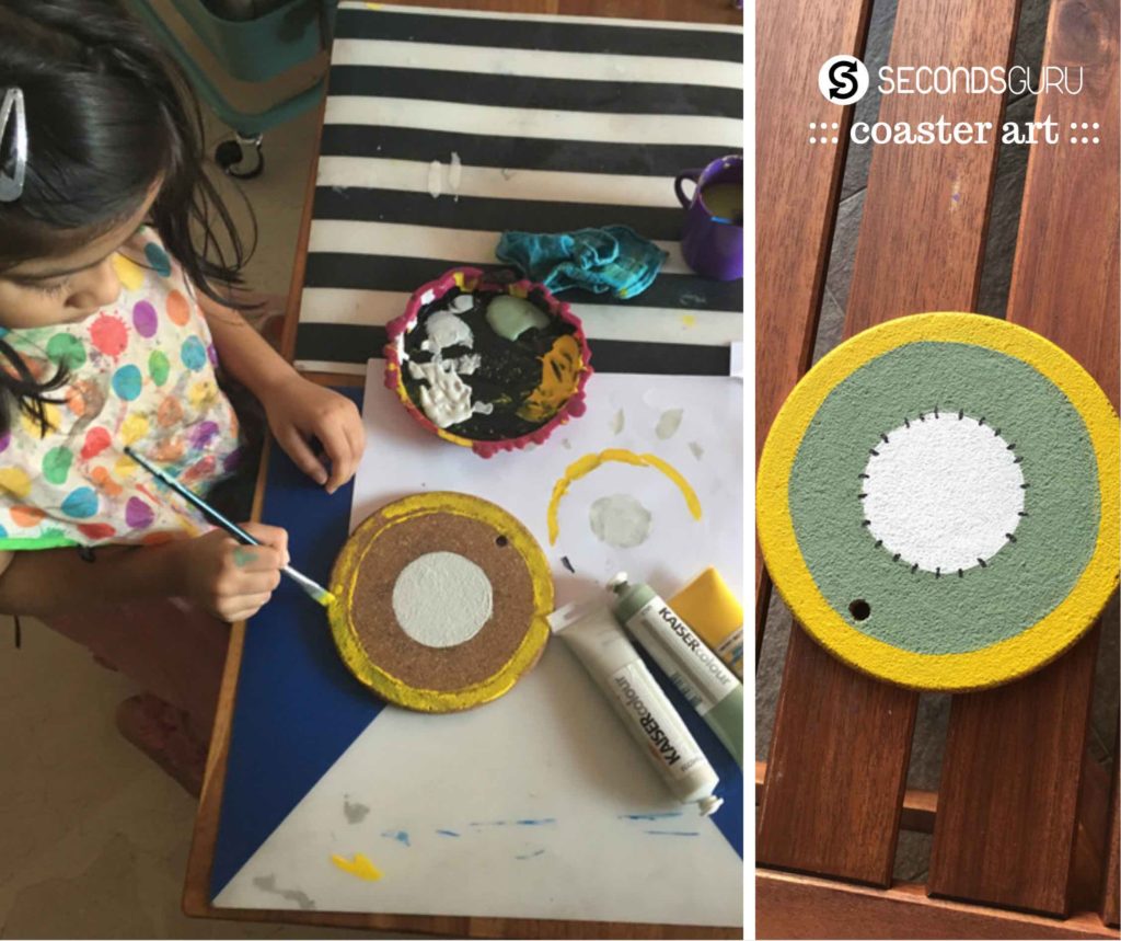 Using paints to upcycle coasters and renew old cork base in kids crafts
